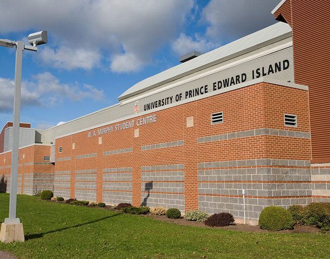 A large brick building with the words university of prince edward island on it