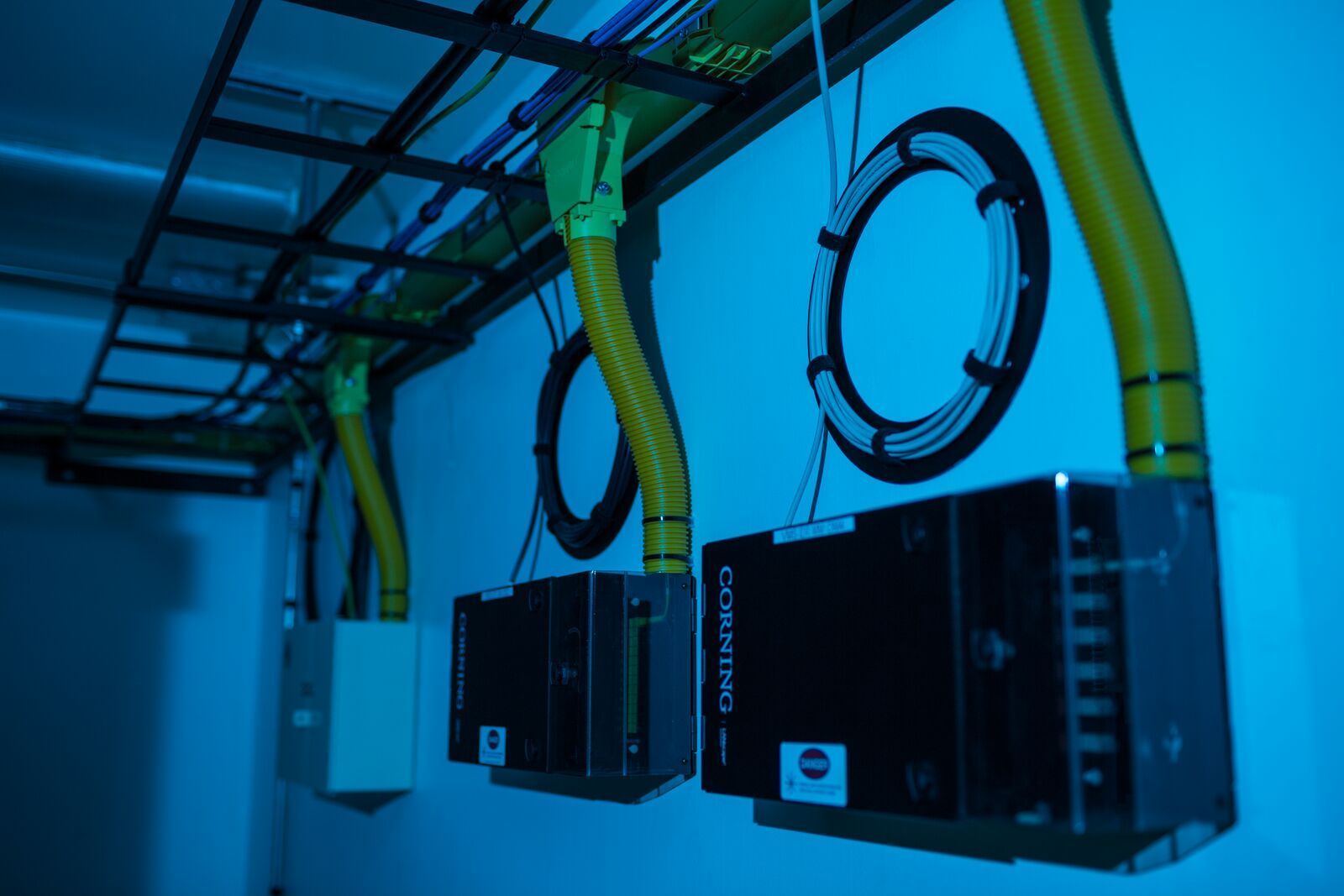 A room with a lot of wires hanging from the ceiling.