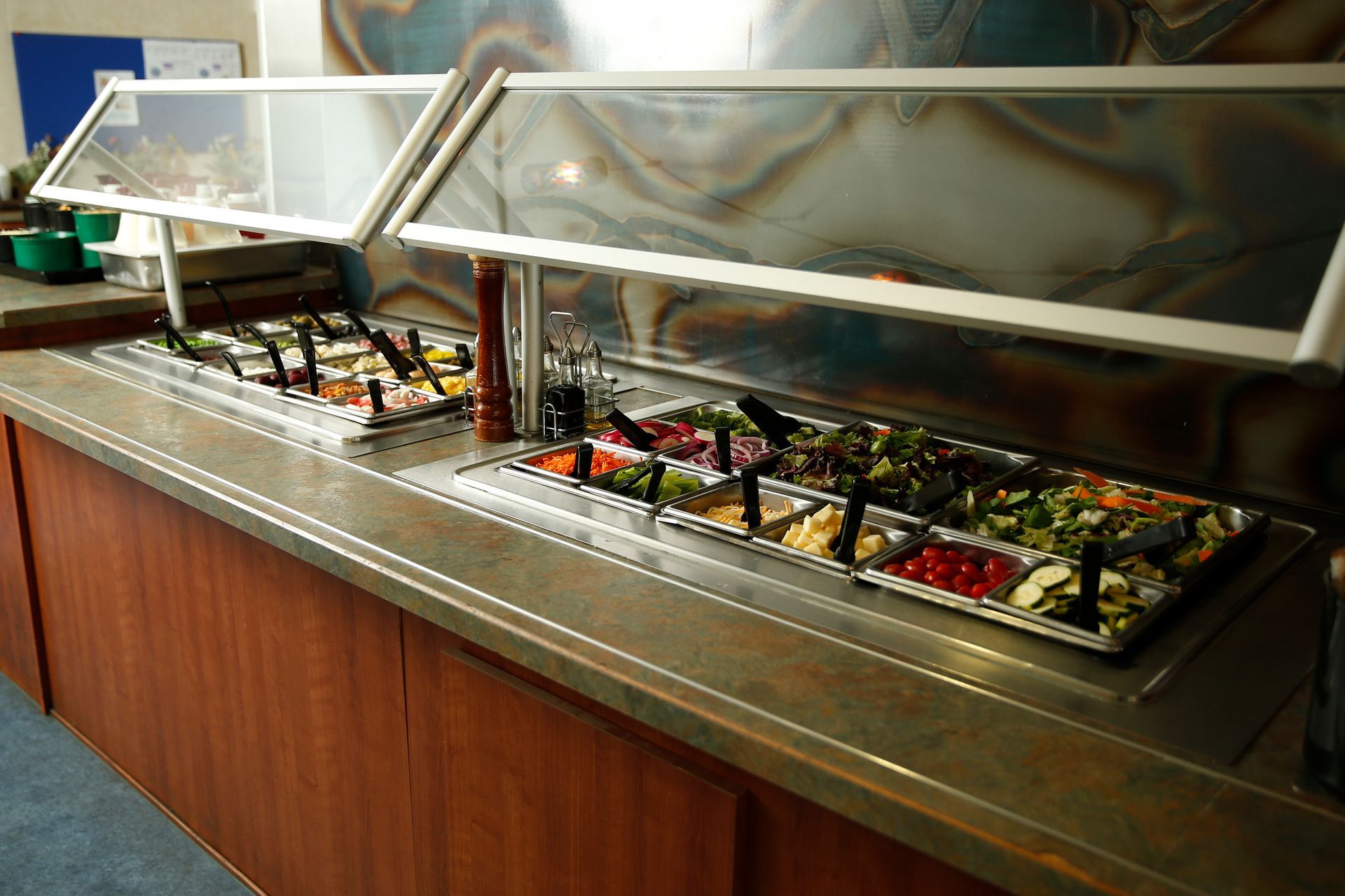 A buffet filled with lots of different types of food