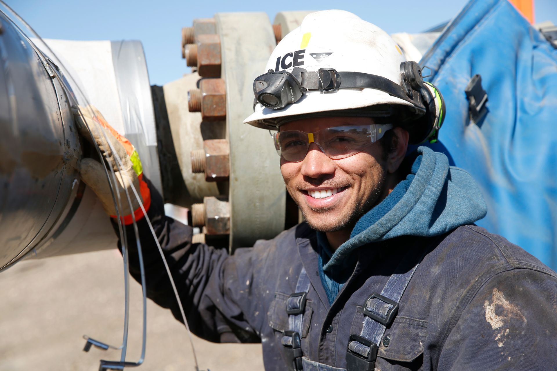 A man wearing a hard hat that says ace on it