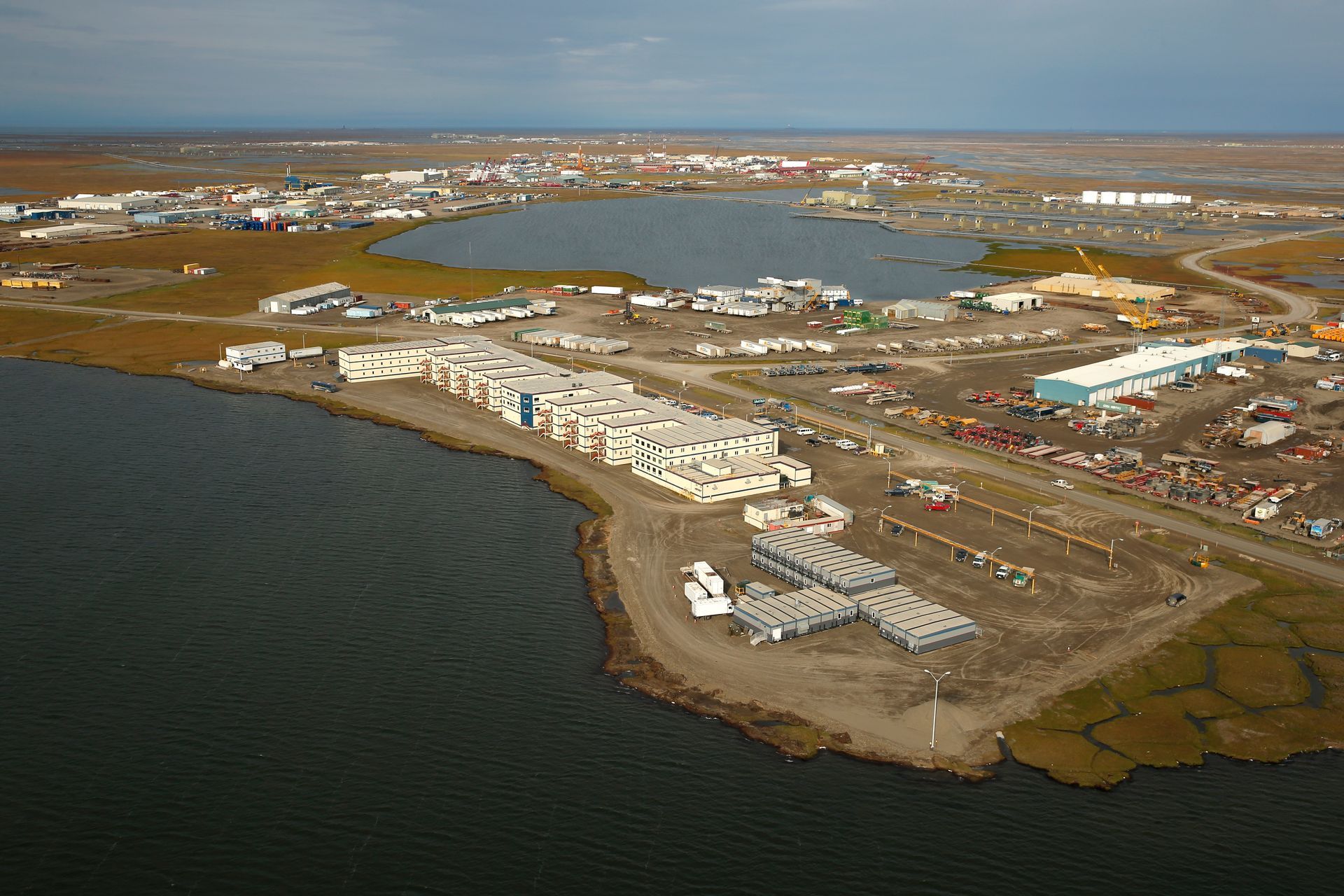 An aerial view of a large body of water surrounded by buildings