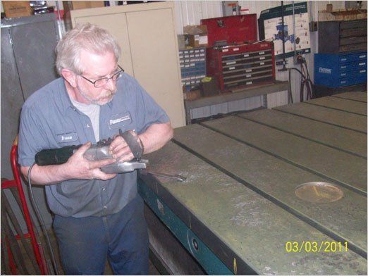 Gib Adjustments — Worker Grinding A Metal In Kaukauna, WI
