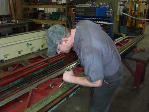 Scraping — Worker Doing Metal Scraping In Kaukauna, WI