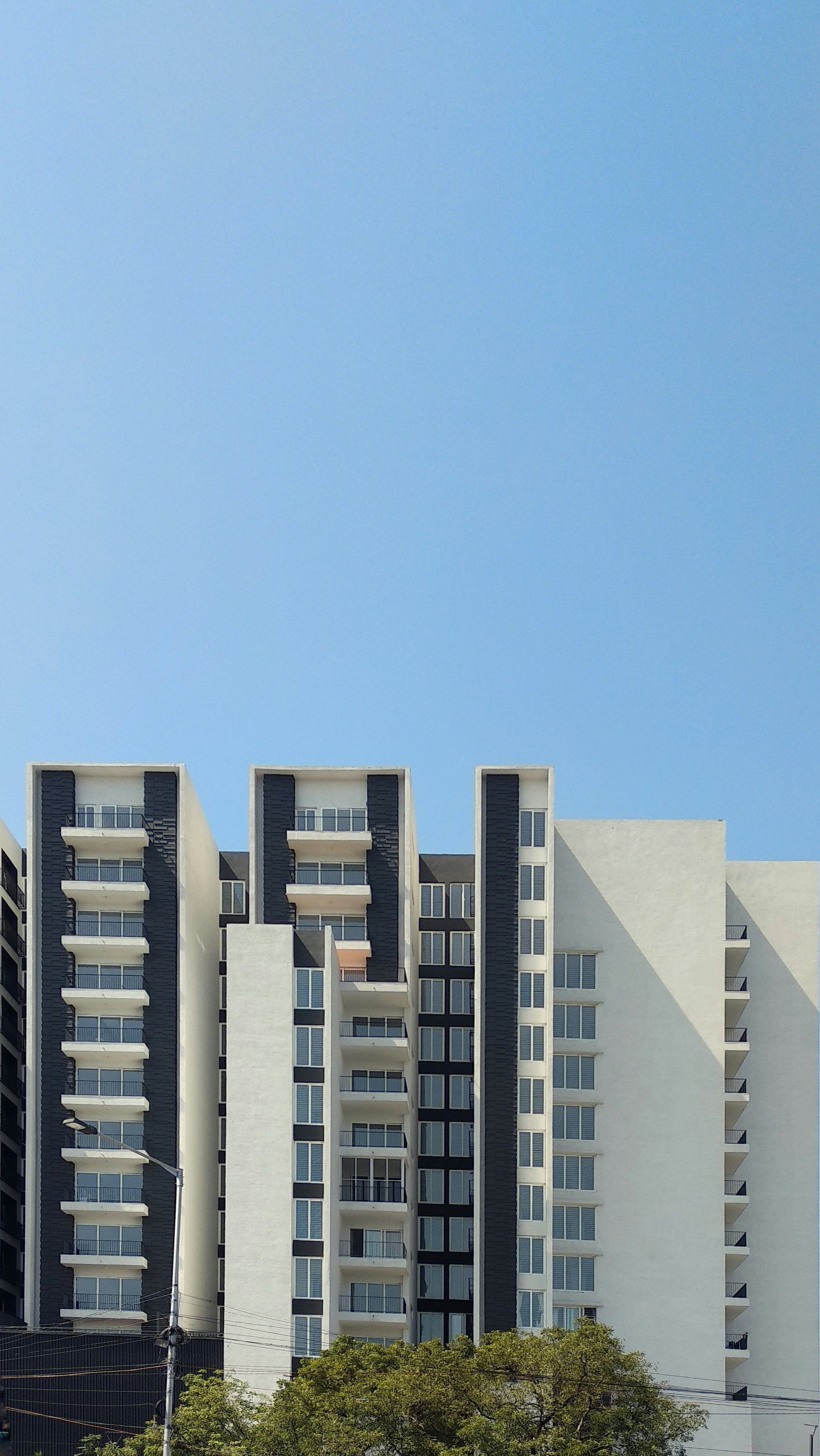 Modern apartment buildings against a clear blue sky