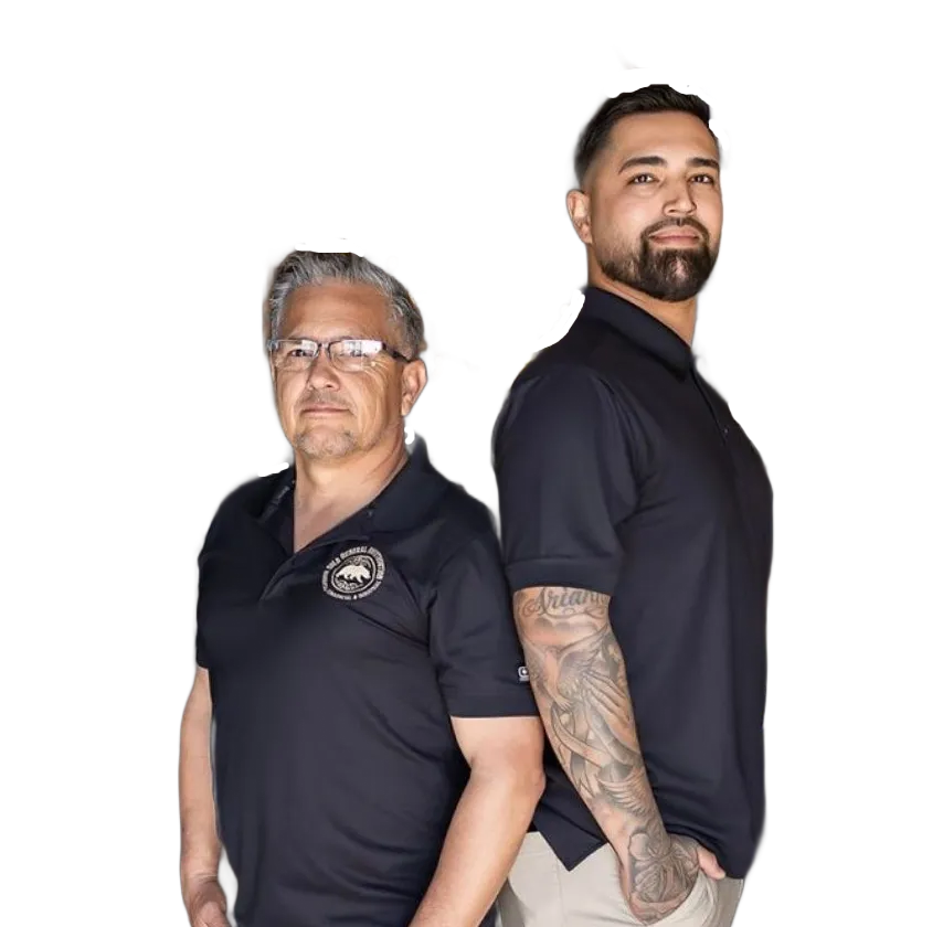 Two men standing back-to-back in black polo shirts against a white background