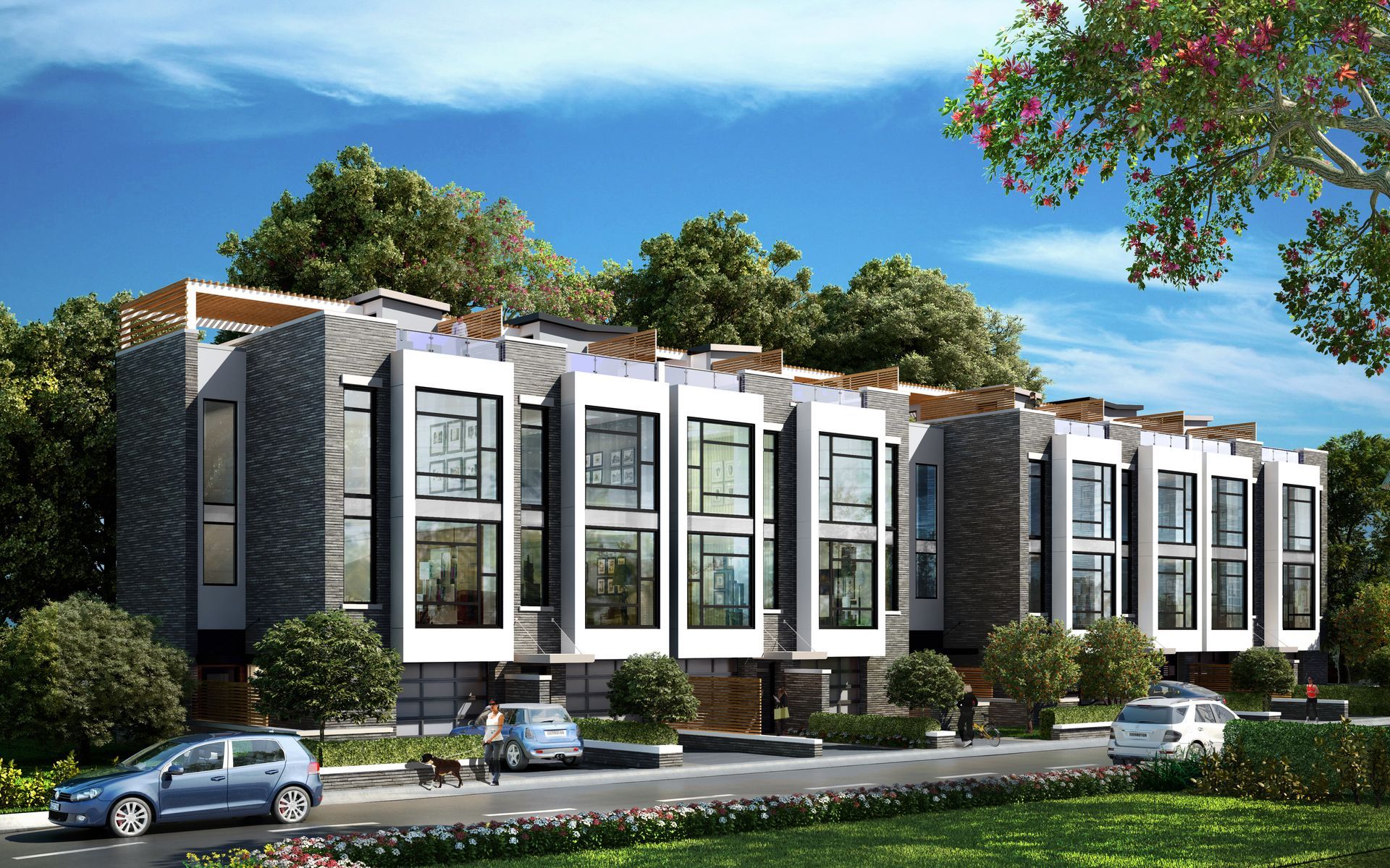 Modern row houses with large windows, dark siding, and green landscaping. Cars parked out front.