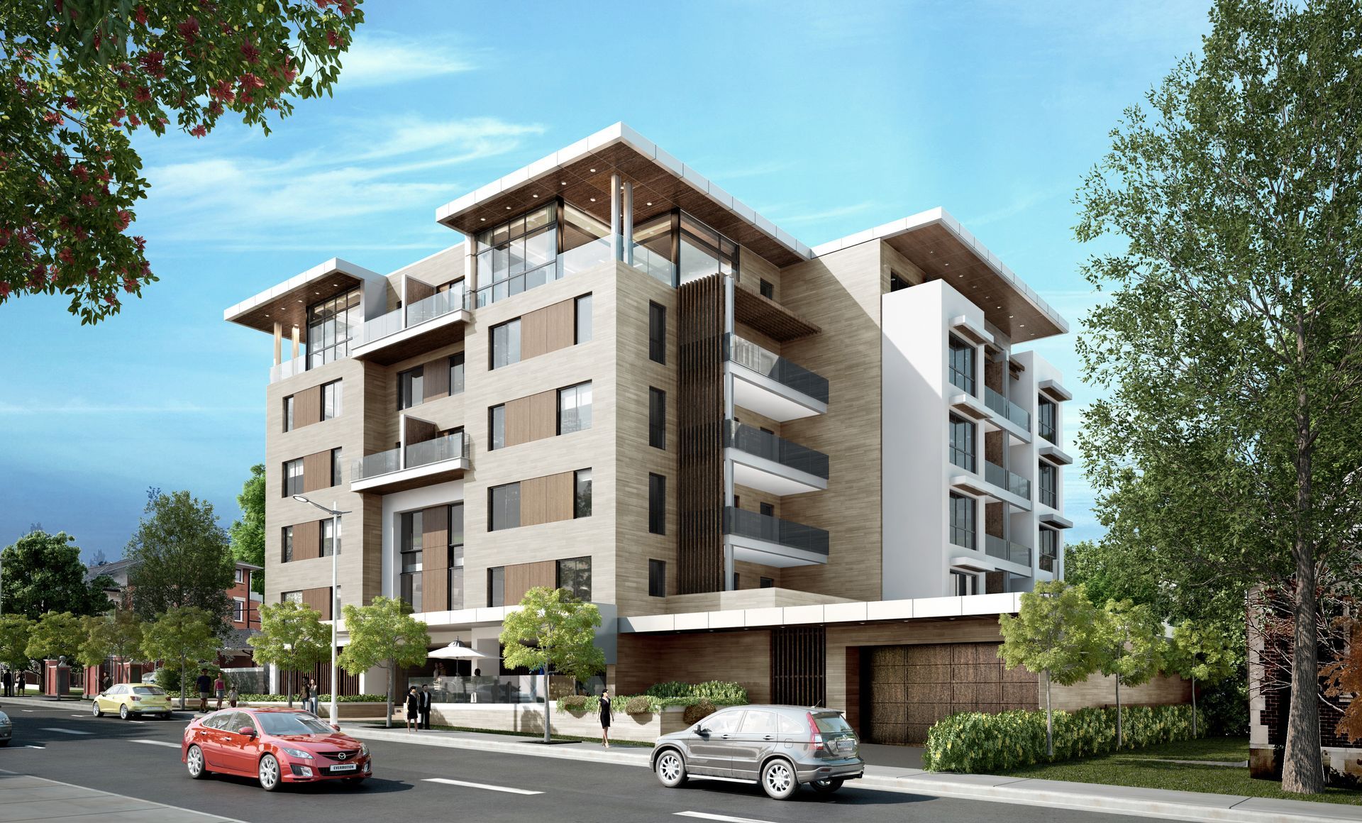Modern apartment building with tan and white facade, balconies, and red and silver cars parked on street.