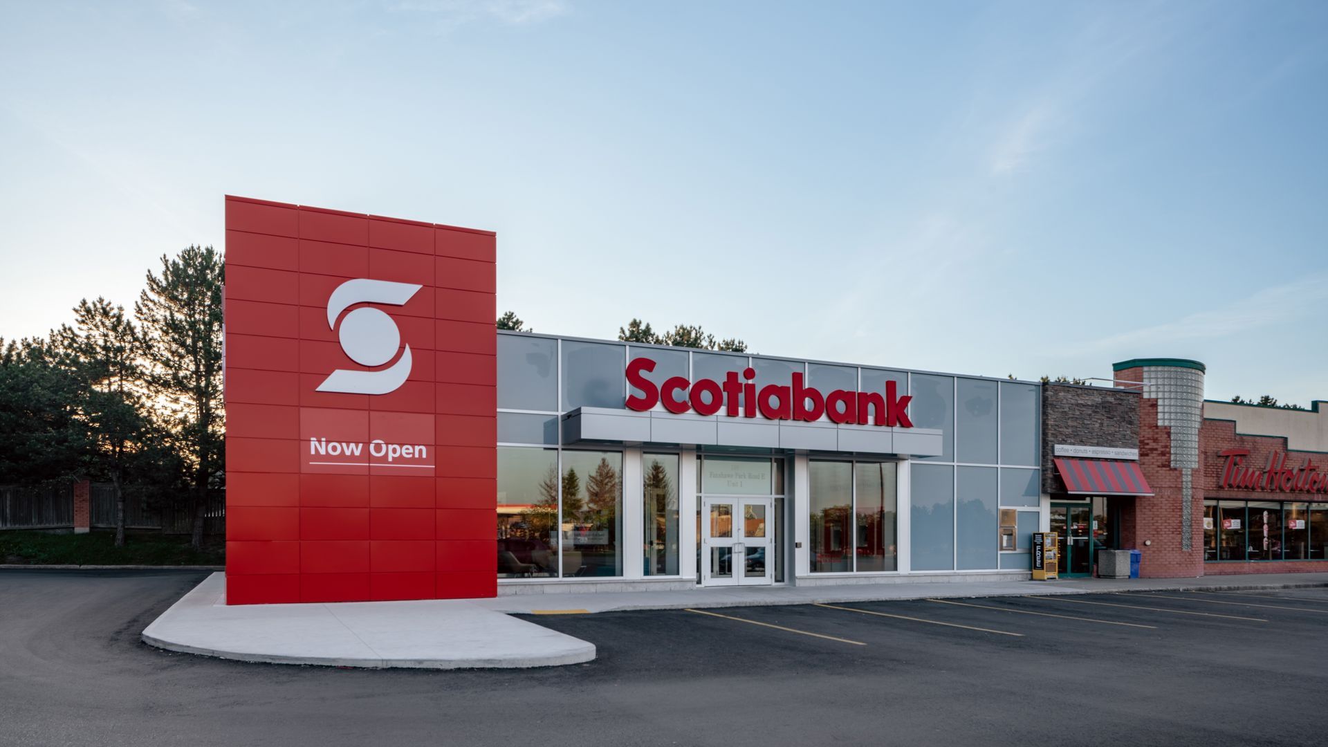 Scotiabank branch building with red signage and a parking lot.