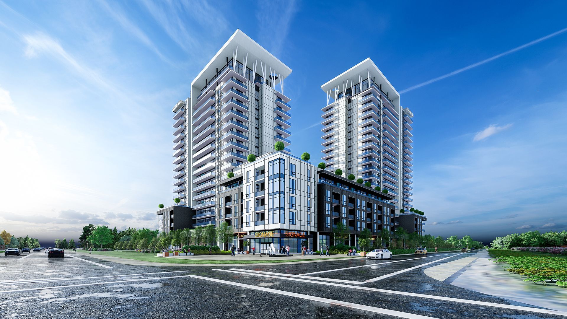 Two modern high-rise apartment towers with a connecting retail section; blue sky, trees, cars on road.