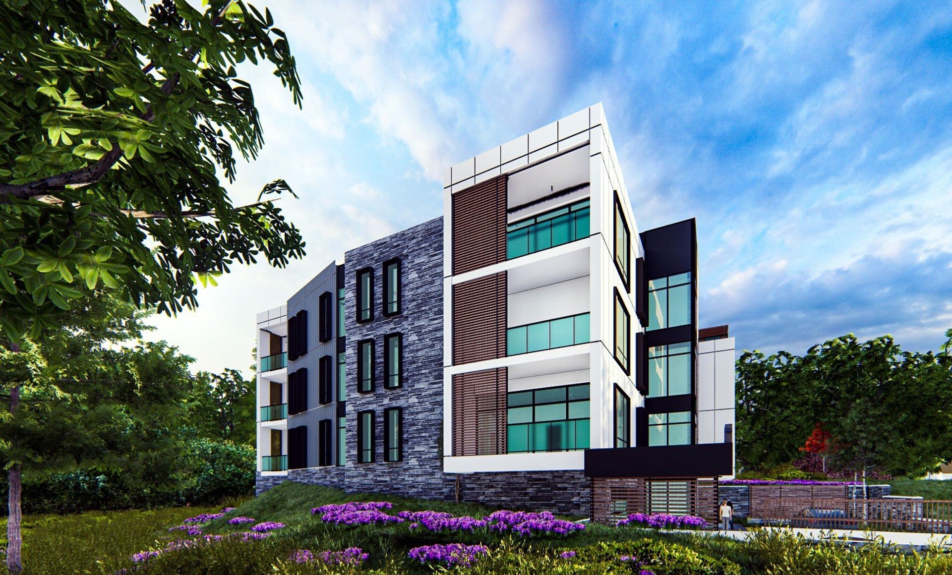 Modern apartment building with stone, white, and black facade, surrounded by trees and purple flowers.