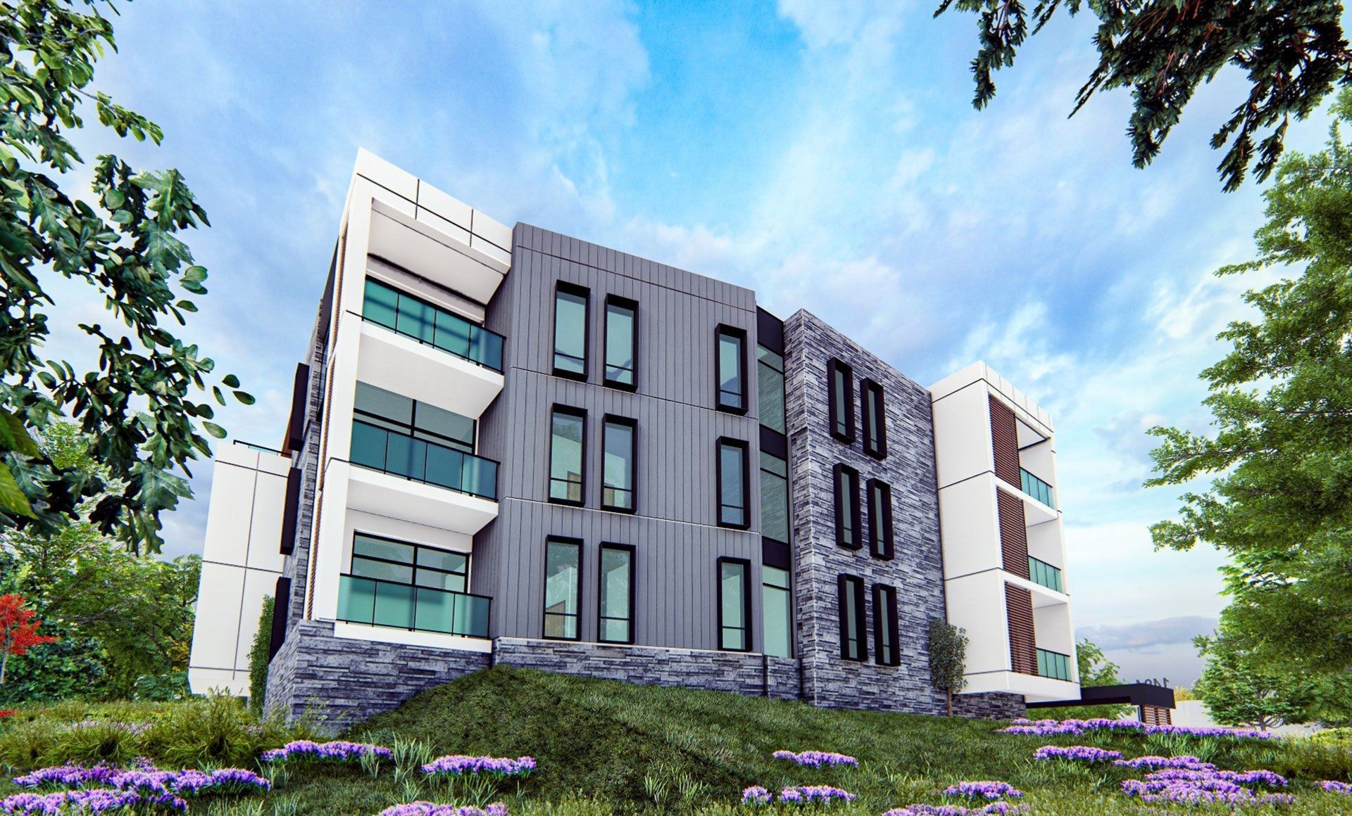 Modern apartment building with balconies, gray and white facade, set against a blue sky and greenery.