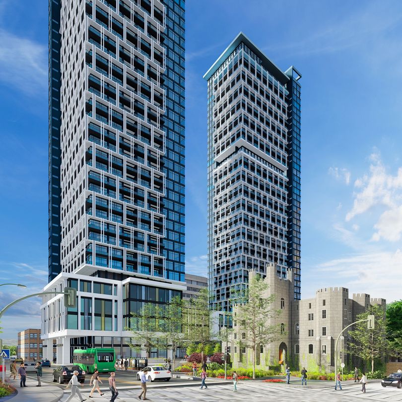 Modern yellow and white high-rise building with retail at ground level, people walking, blue sky.