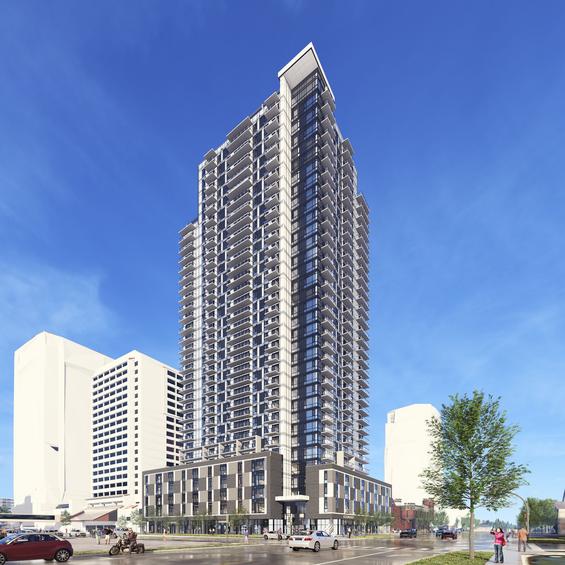 Modern high-rise apartment buildings with glass facades and balconies under a bright blue sky.