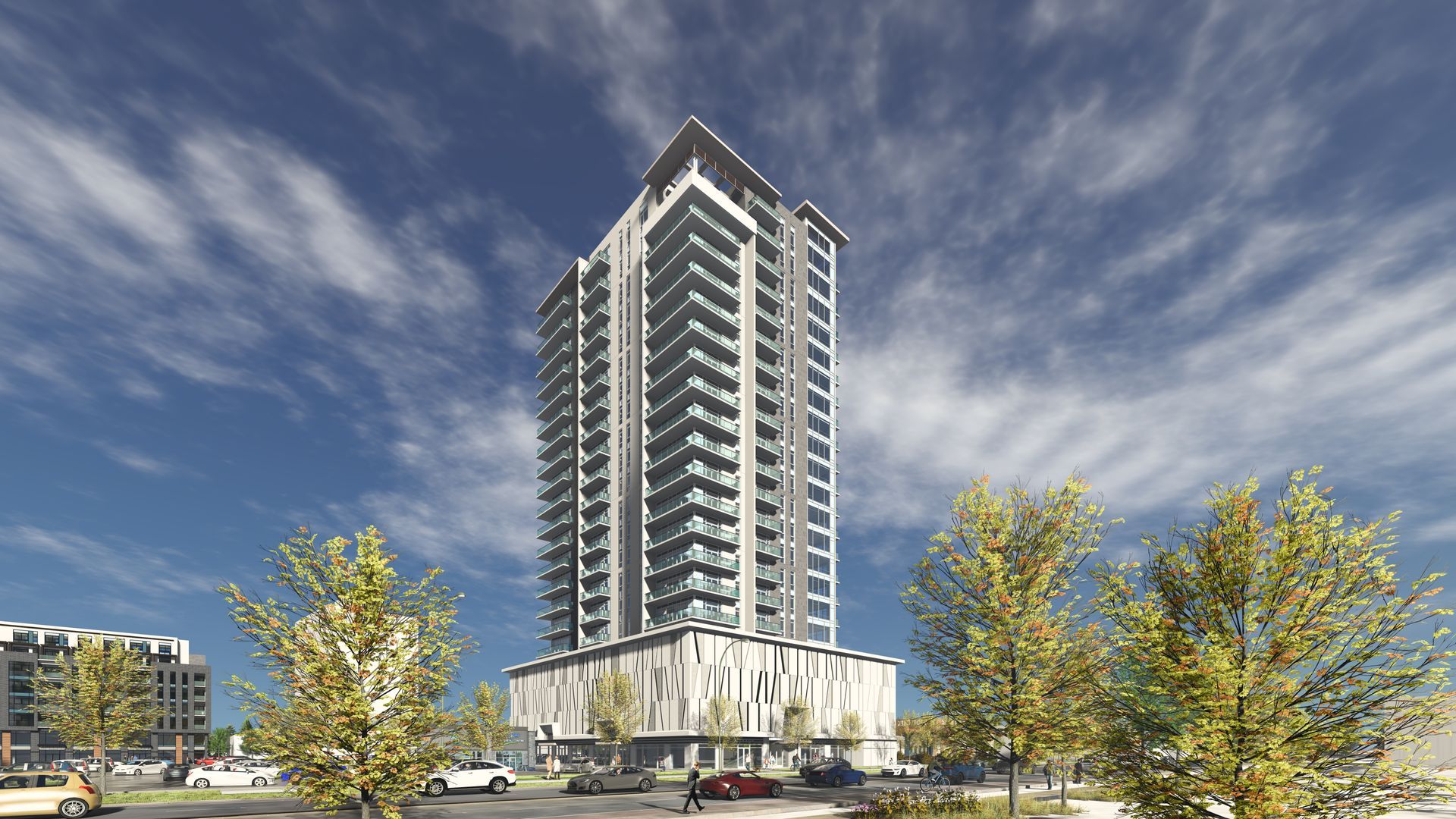 High-rise apartment building with light facade and gray upper levels, blue sky.