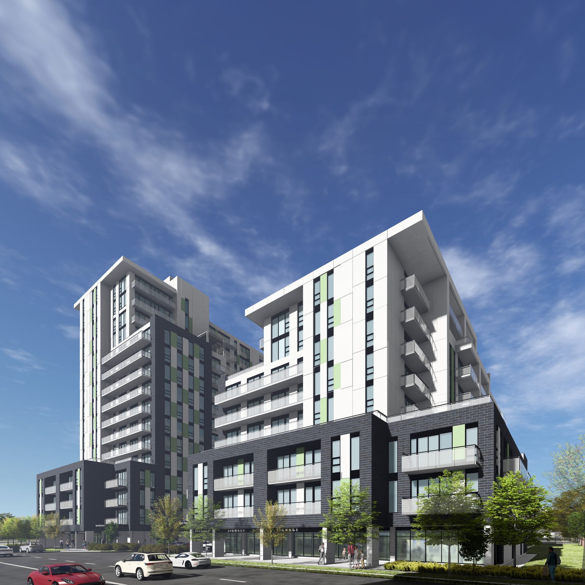 Multi-story modern apartment buildings with green and gray accents under a blue sky.
