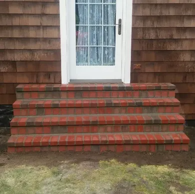 Rebuilt porch steps with new brick and mortar