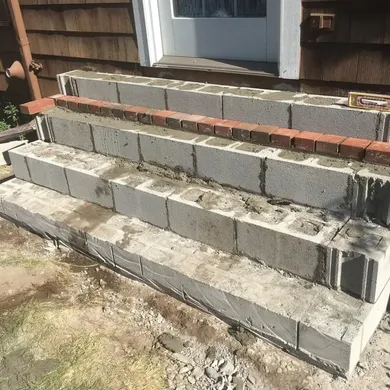 Porch landing releveling and brick replacement