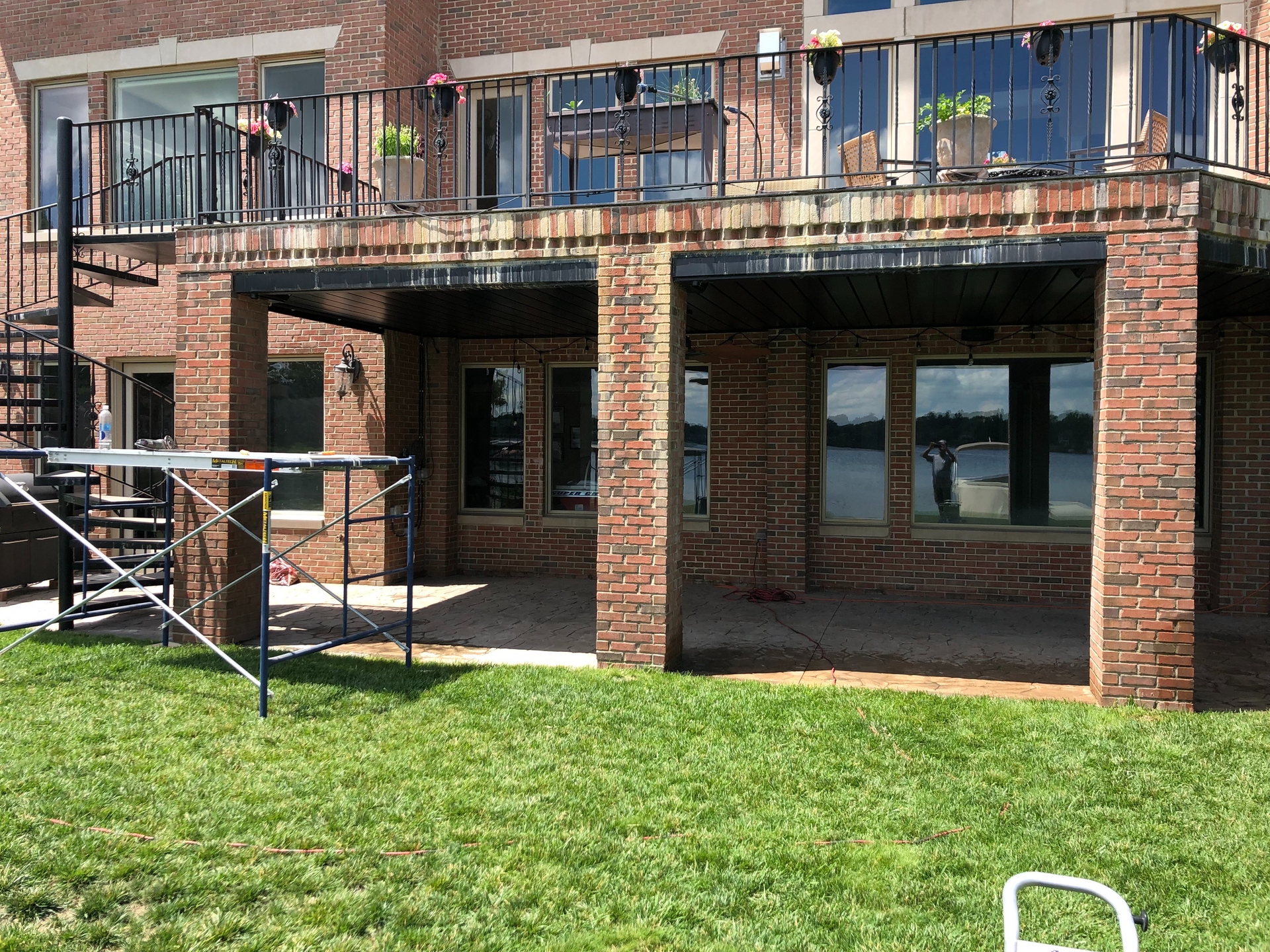 Before chemical cleaning: Stained brickwork showing heavy discoloration on a house in Oakland County.