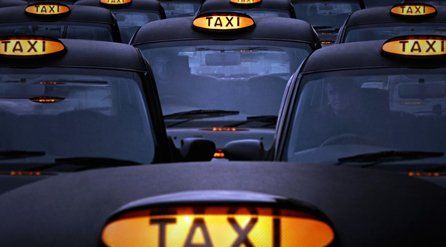 Hackney Cabs with their TAXI signs illuminated