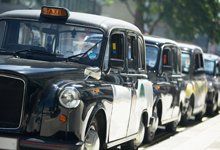 A row of black Hackney Cabs