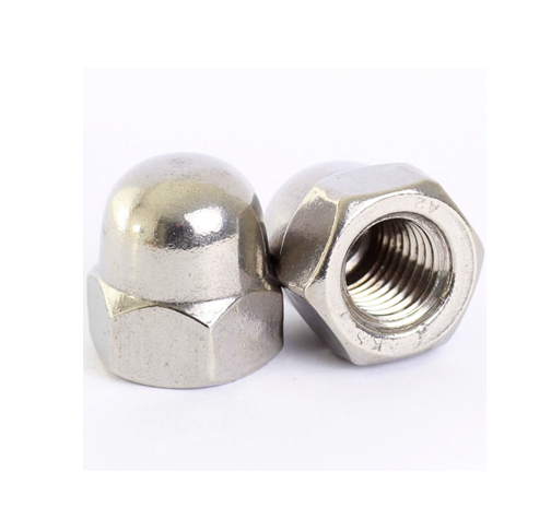 A pair of stainless steel dome nuts on a white surface.