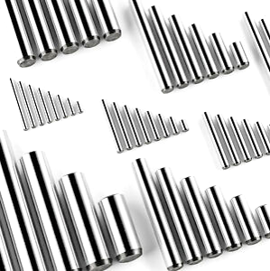 A close up of a bunch of metal pinson a white surface.