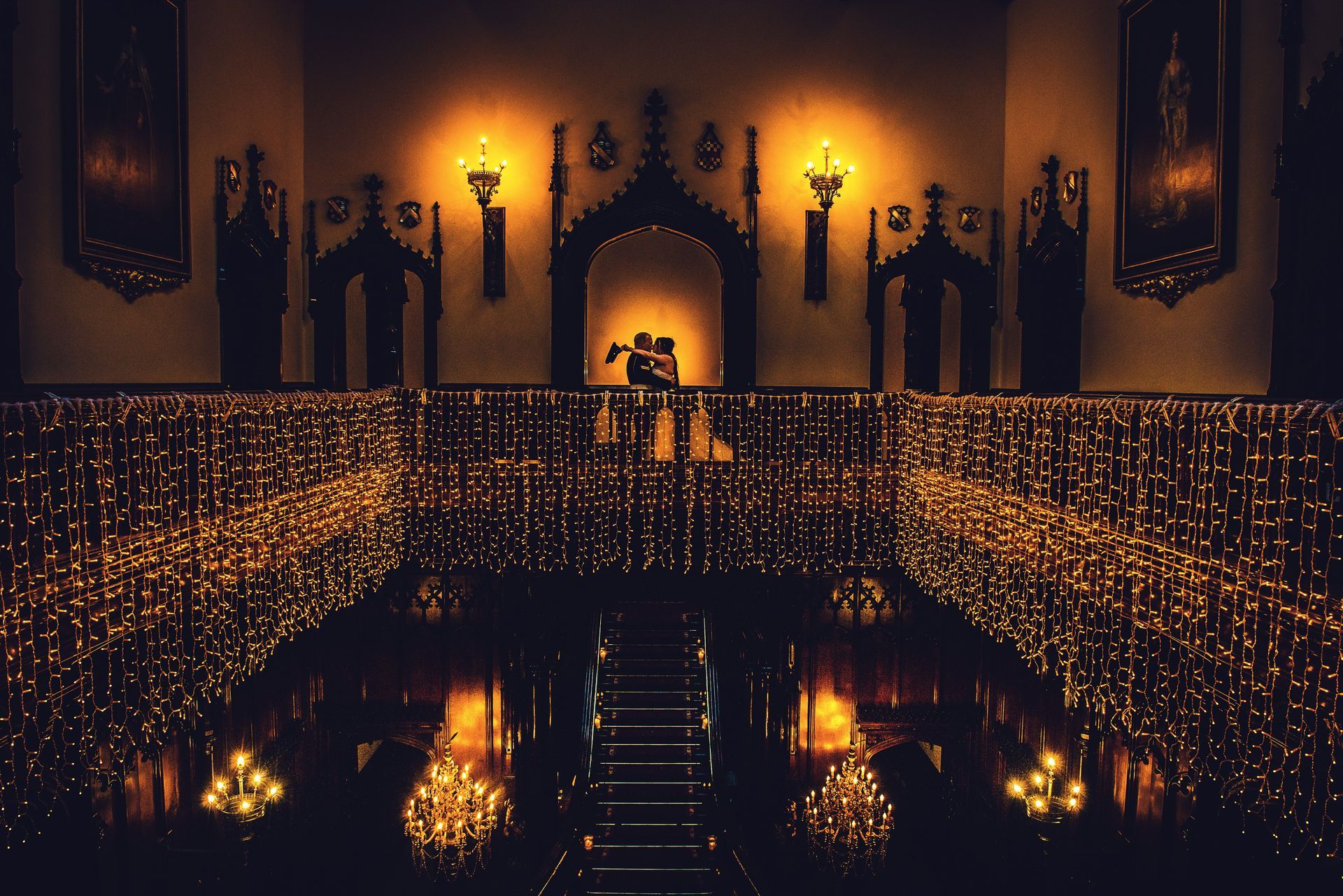 A silhouette of a couple during a wedding, lit with an intricate design of lights by Exclusive Entertainment suppliers for events across the north of England.