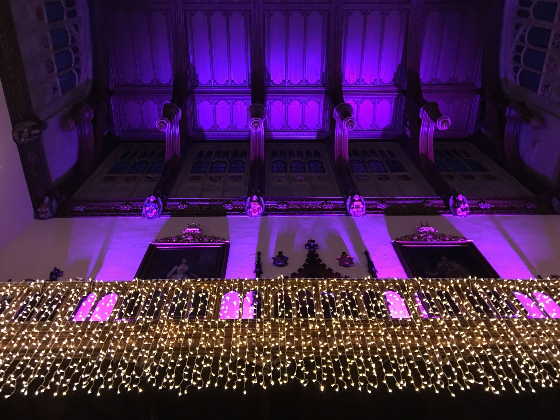 A ground level shot of the fairy light curtain around the gallery at Allerton Castle