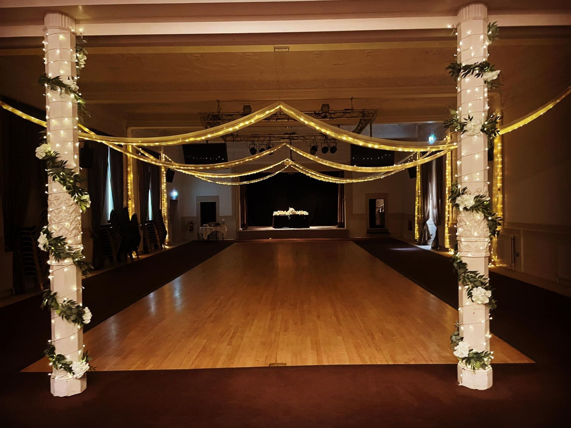 Decor and Lighting in soft whites surround a  hired dance floor. Production services and equipment  hire for this wedding was supplied by Exclusive Entertainments Harrogate,Yorkshire