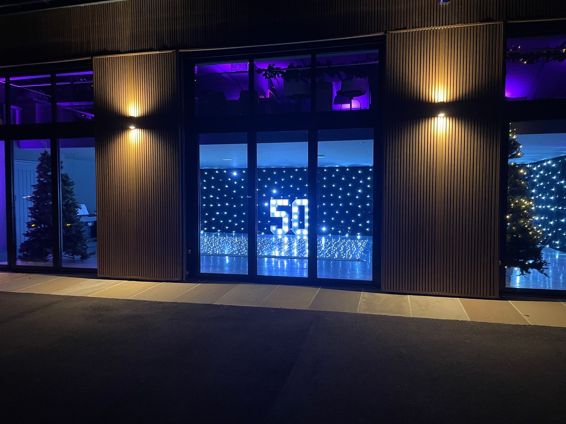 Dance floors and Decor event lit with cool blue lights and a 50 light from Exclusive Entertainments. 