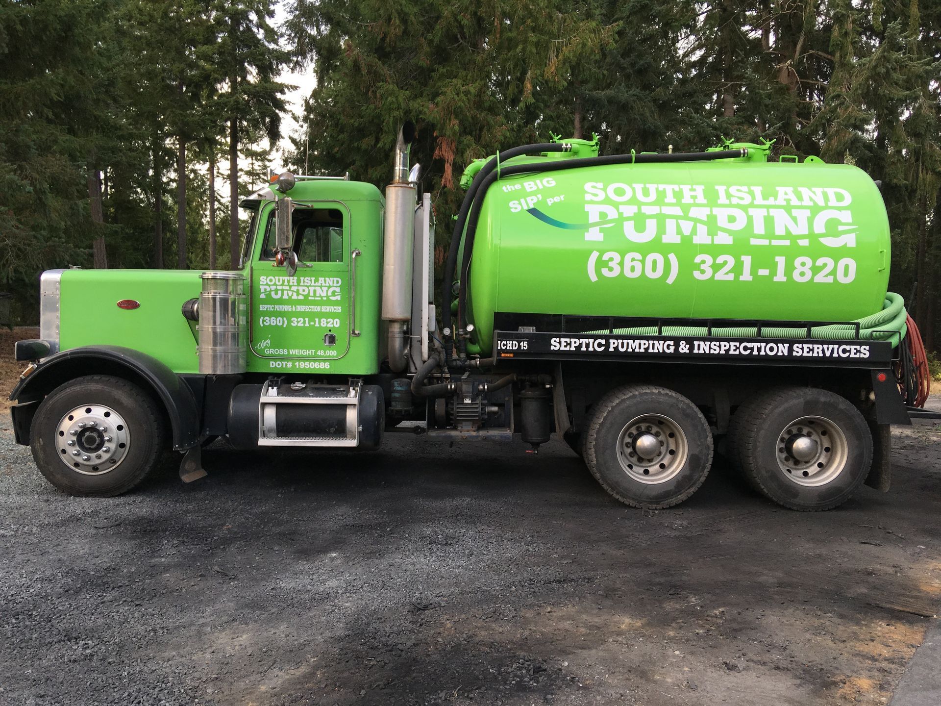 Green septic pumping truck with