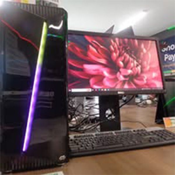 A computer with a keyboard and a monitor with a flower on the screen