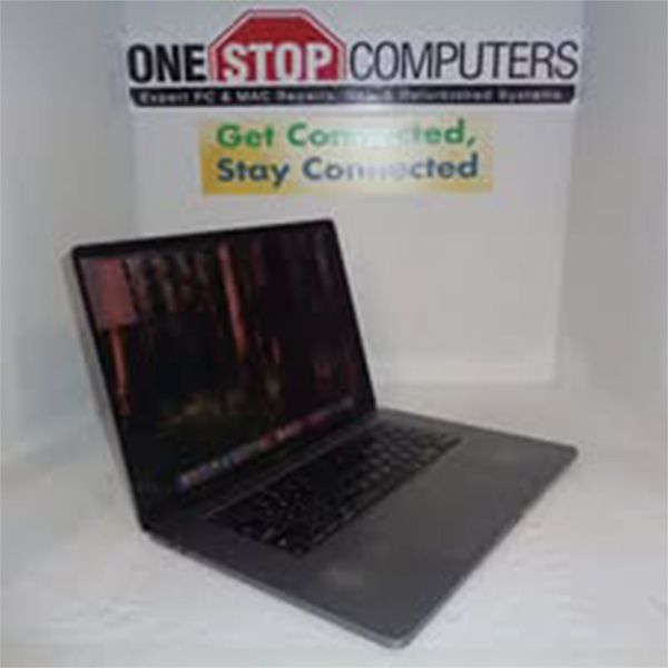 A laptop is sitting in front of a one stop computers sign