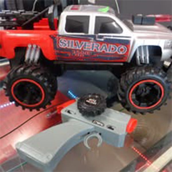 A silverado toy truck with a remote control attached to it