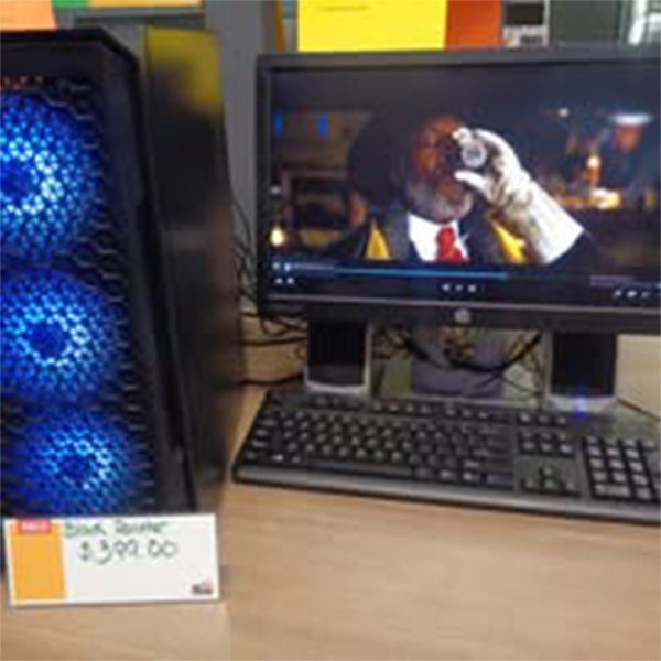 A computer monitor with a picture of a man taking a picture on it