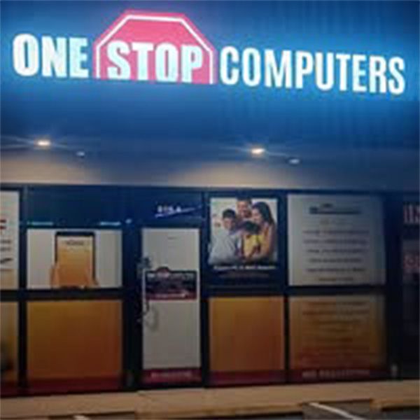 A store front with a sign that says one stop computers