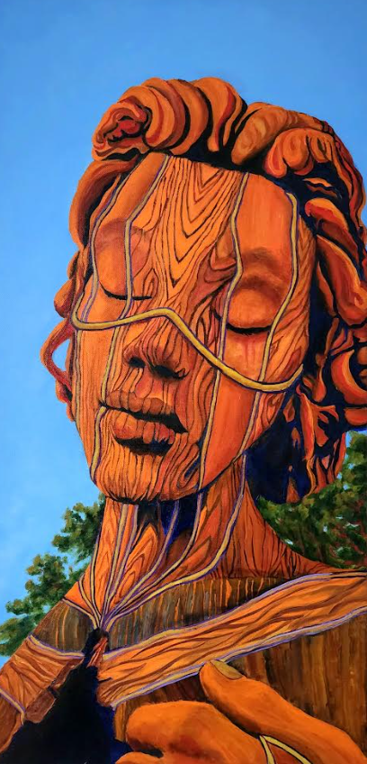 A wood-textured statue of a person with closed eyes, against a blue sky.