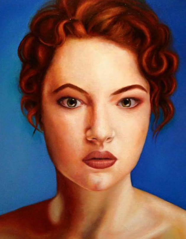 Woman with reddish-brown curly hair and fair skin gazes forward against a blue background.