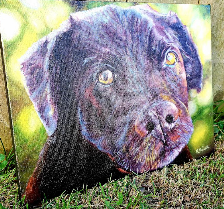 Close-up of a Labrador Retriever painted on canvas; black fur, focused eyes, green background.