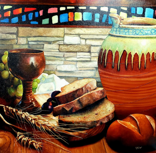 Still life painting: bread, grapes, chalice, jug, and wheat on wooden table, stone wall background.