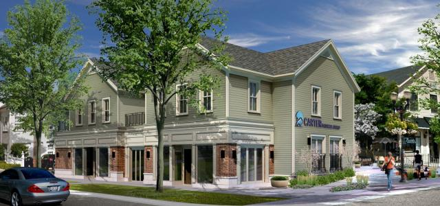A waterfall cascading over a dam. White water foams below, dark water in the background.