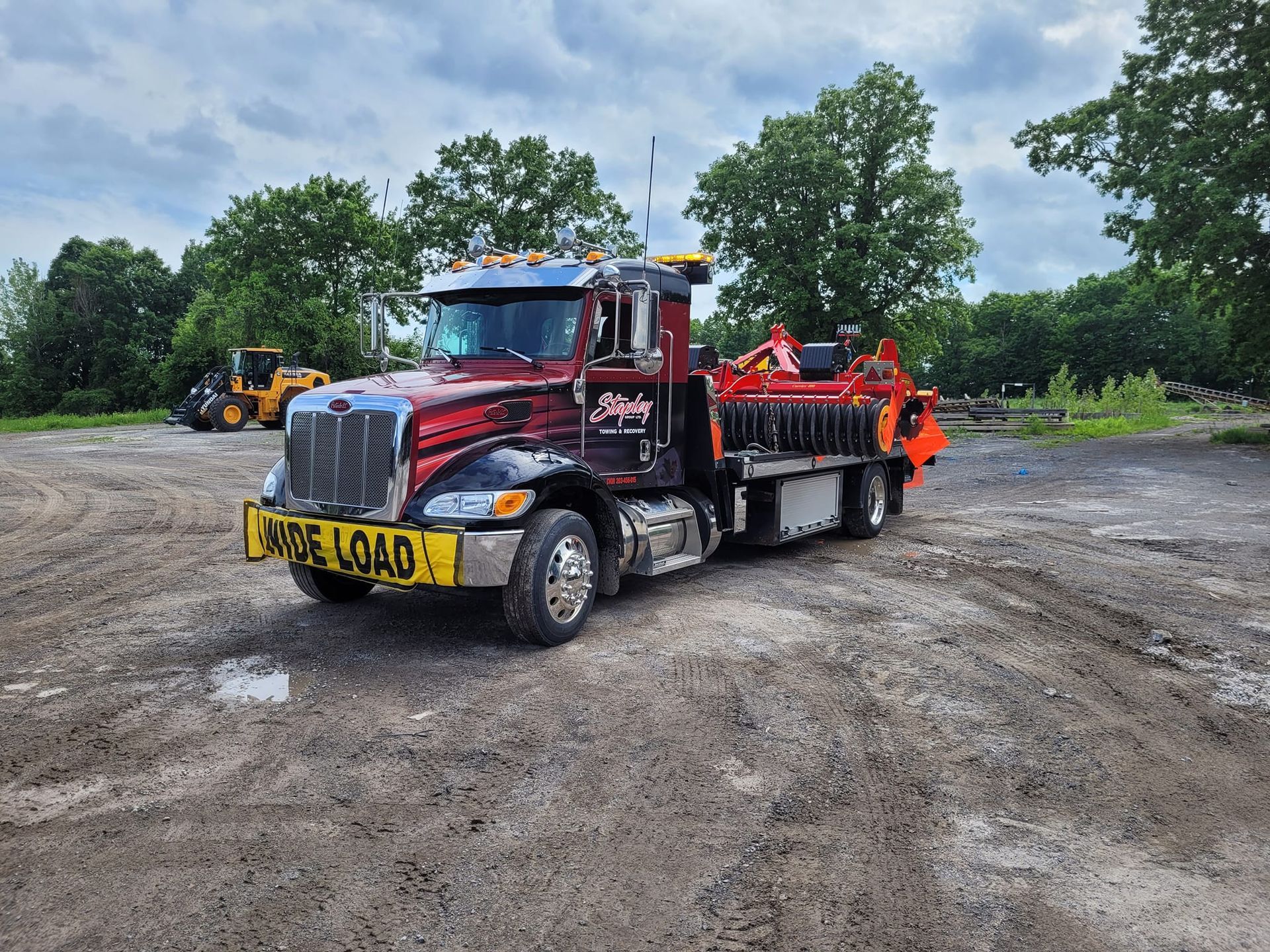 Red and black tow truck with 