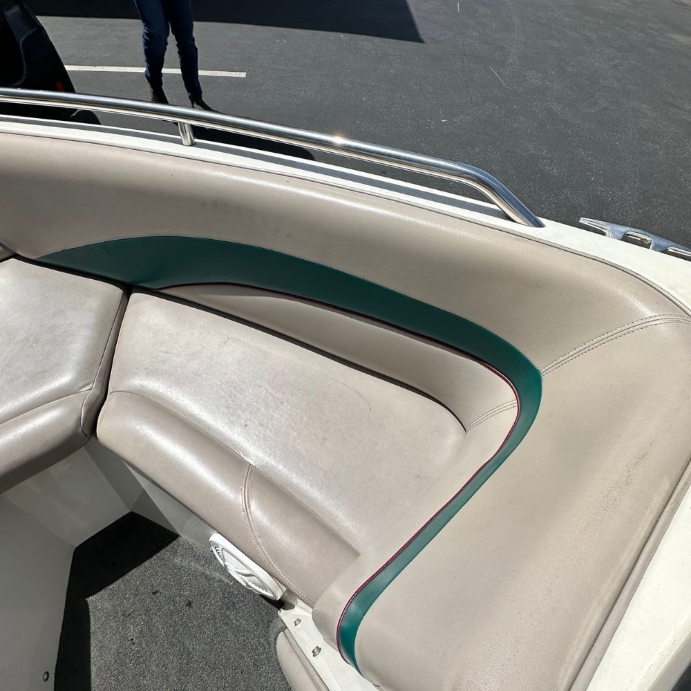 A boat seat with a green stripe on it