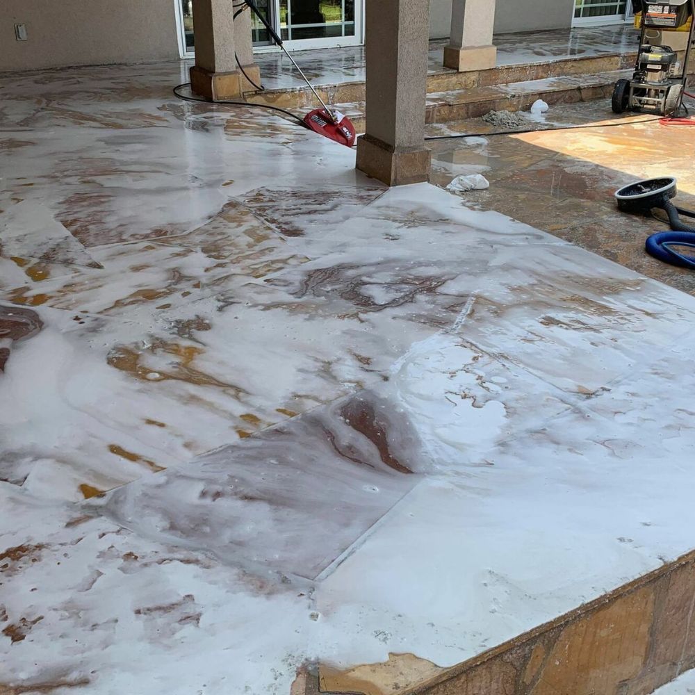 A dirty floor with a lot of foam on it.