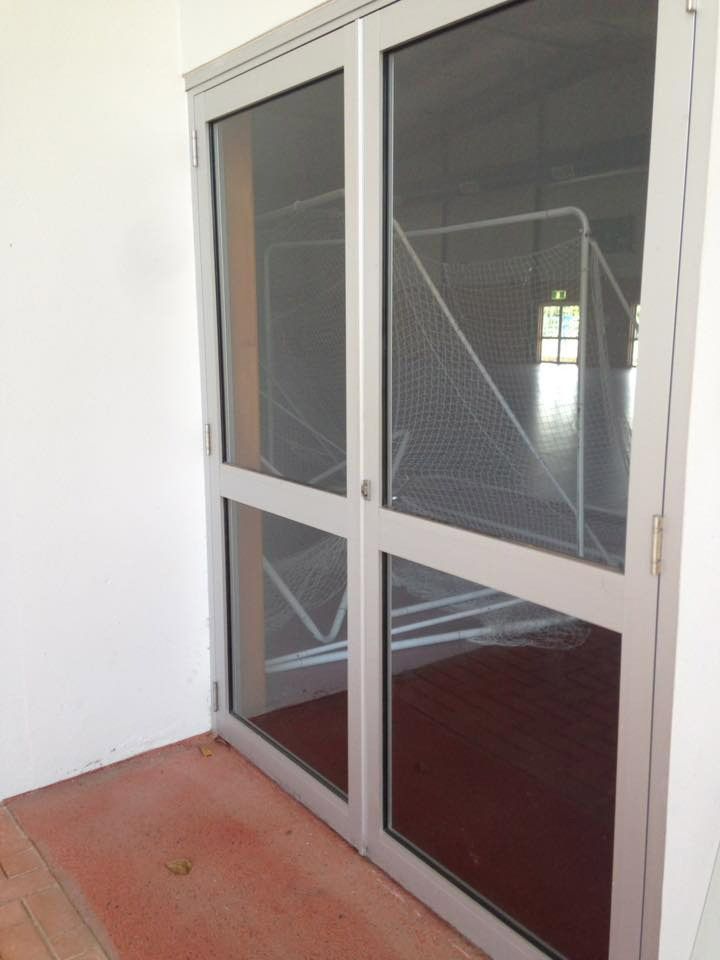Stylish and functional glass double door offering a contemporary entrance solution — Cairns All Star Glass 'n' Aluminium in Bentley Park, QLD
