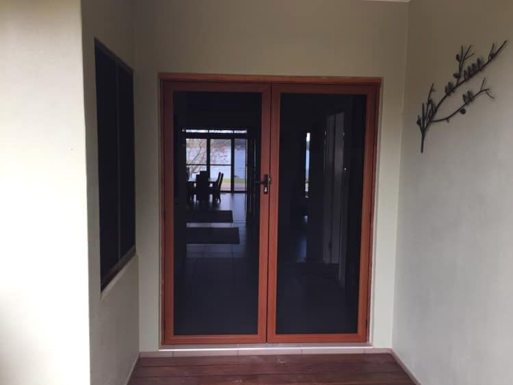 Tinted Glass Door — Cairns All Star Glass 'n' Aluminium in Bentley Park, QLD