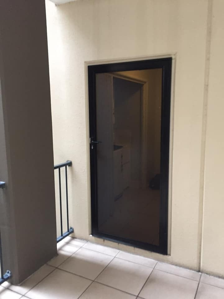Secure screen door providing insect protection and allowing fresh airflow — Cairns All Star Glass 'n' Aluminium in Tablelands, QLD