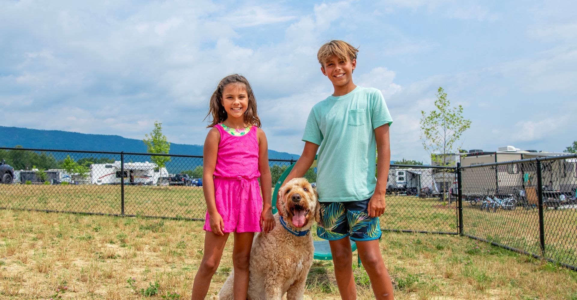 Kids and a dog in the dog park