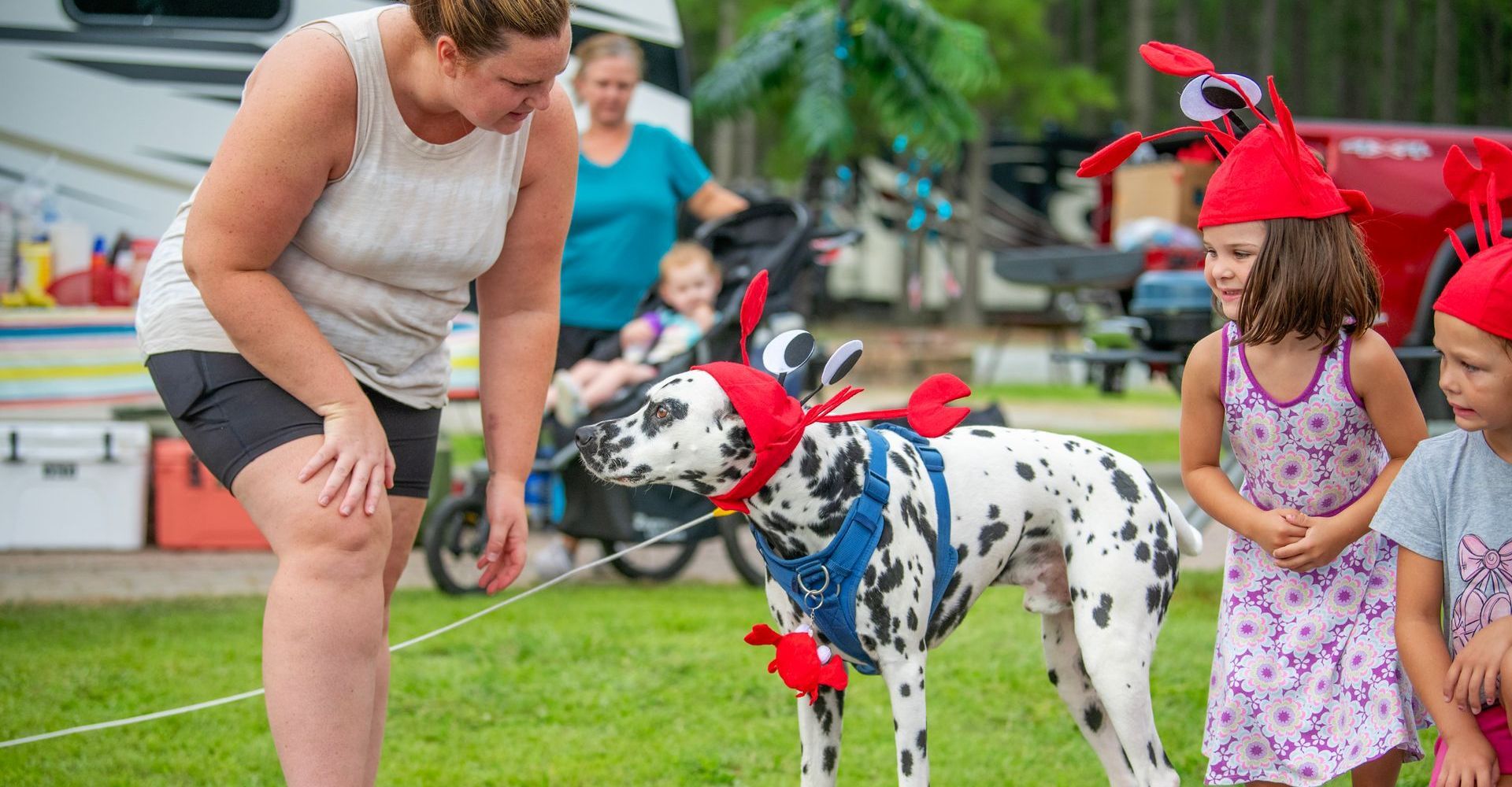 A family with their dog dressed up for an event