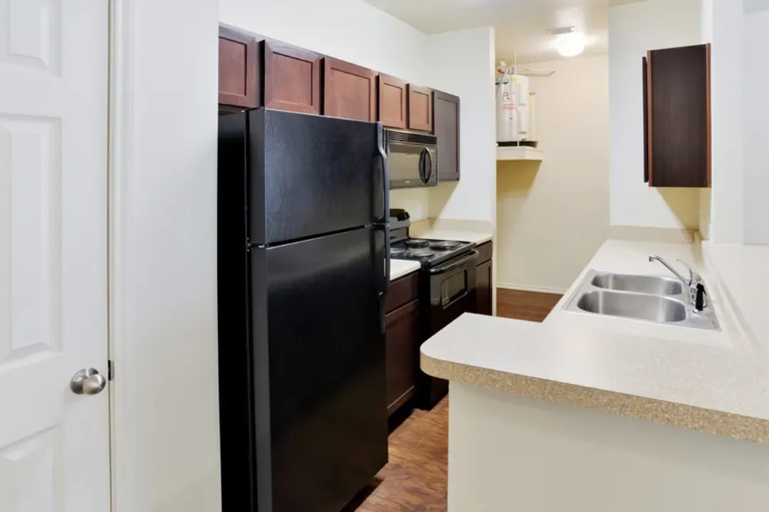 Interior of kitchen with black appliances